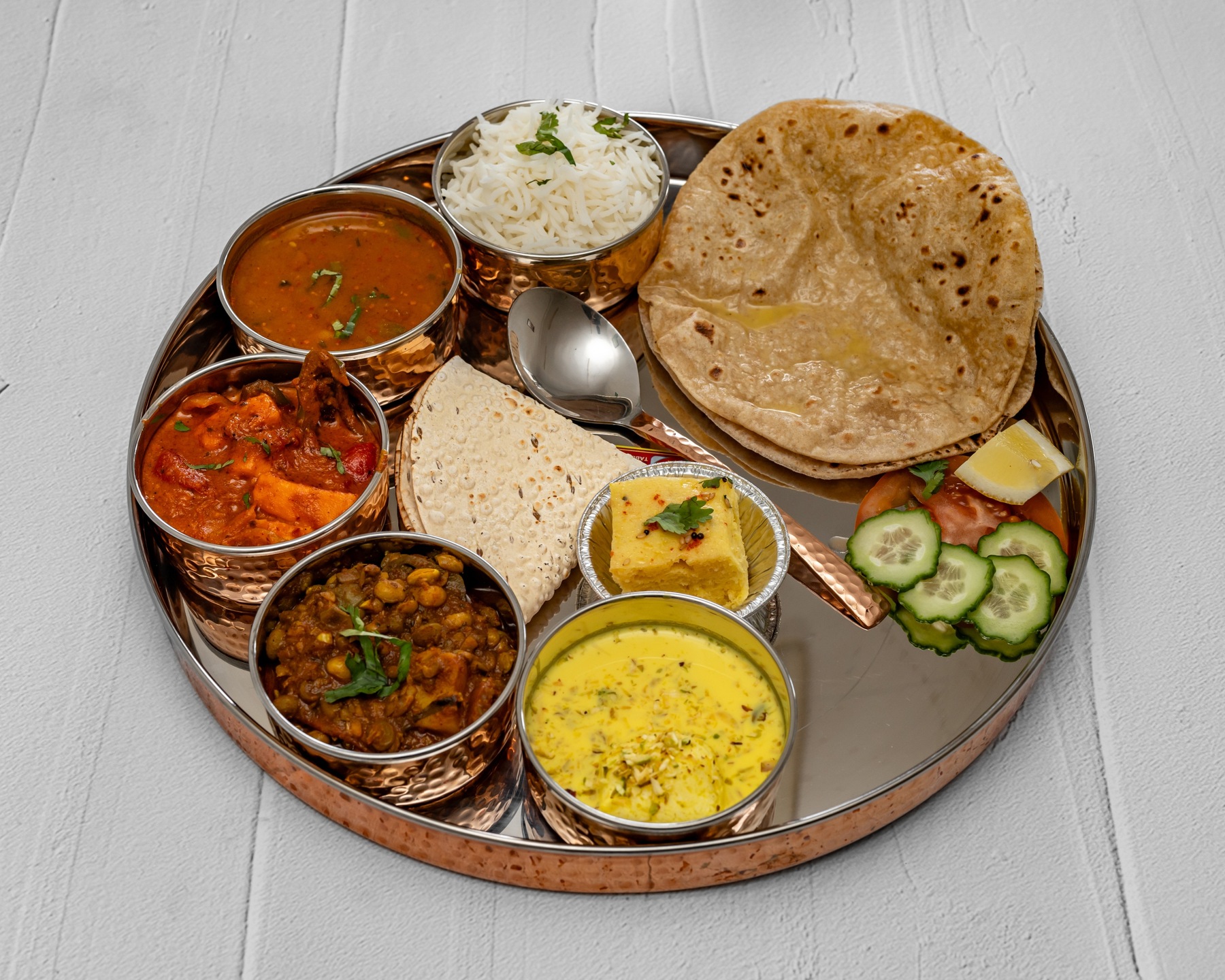 Govardhan Thali with curries, roti, rice and accompaniments